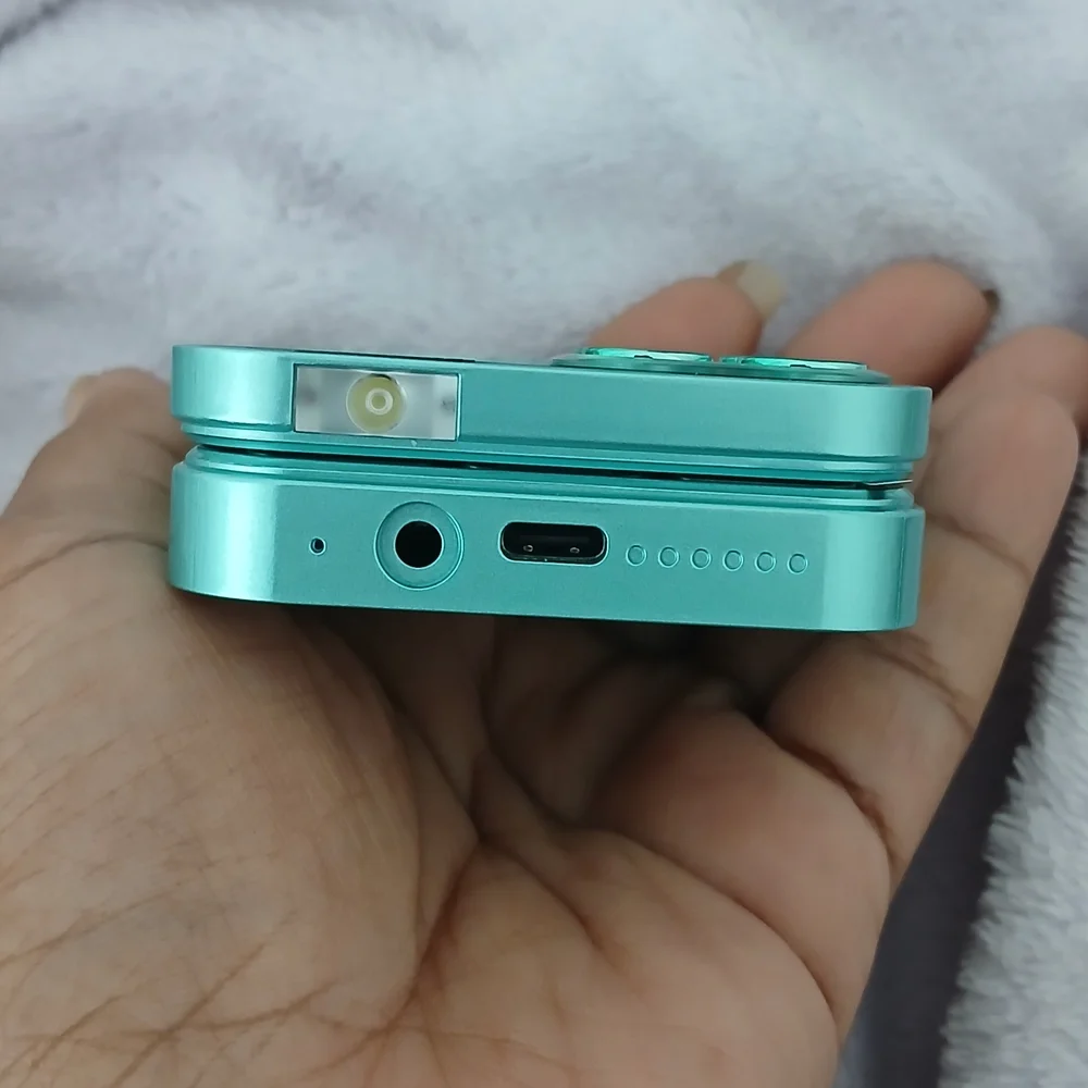 Compact Teal Digital Camera with Quad Lens